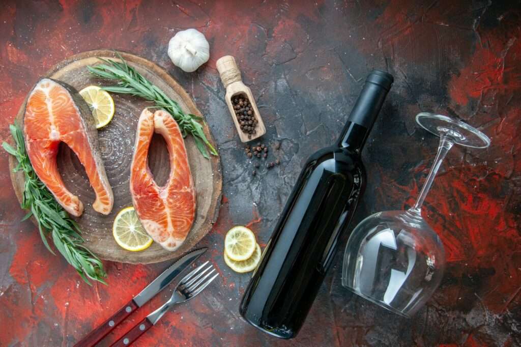 top view fish slices with bottle of wine on the dark background food color photo seafood dish meat